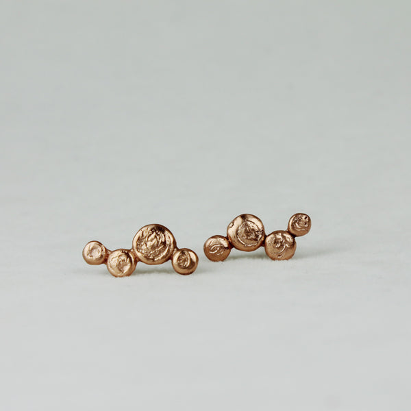 Orecchini in bronzo con perno