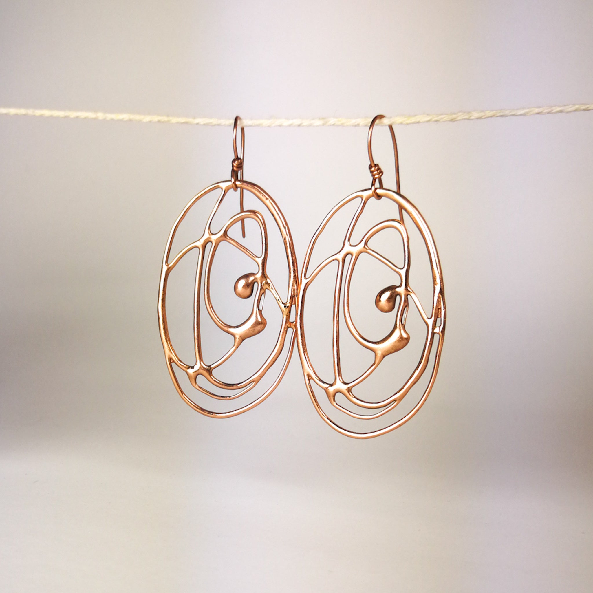 Orecchini Vortice in bronzo, pendenti.
